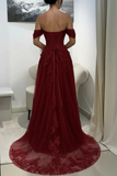 Red evening gown with floral details on a white chair.