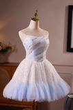 Short, one-shoulder dress with blue and white gradient on a mannequin against a neutral background.
