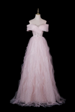 A light pink off-the-shoulder tulle ball gown displayed on a white mannequin against a solid black background.