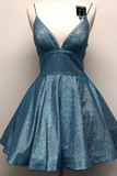 A sparkly blue homecoming dress with spaghetti straps and a flared skirt, displayed on a mannequin against a plain light background.
