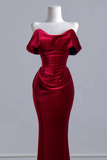 A deep red velvet off-the-shoulder evening gown displayed on a white mannequin torso against a light gray background.