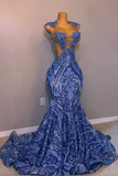 Blue evening gown on a mannequin against a plain wall.