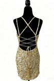 Gold sequin dress with criss-cross straps on a mannequin against a white background
