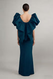 Teal evening gown with ruffled shoulders on a plain background