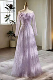 Lavender evening gown on a mannequin in a room with a window and plant.